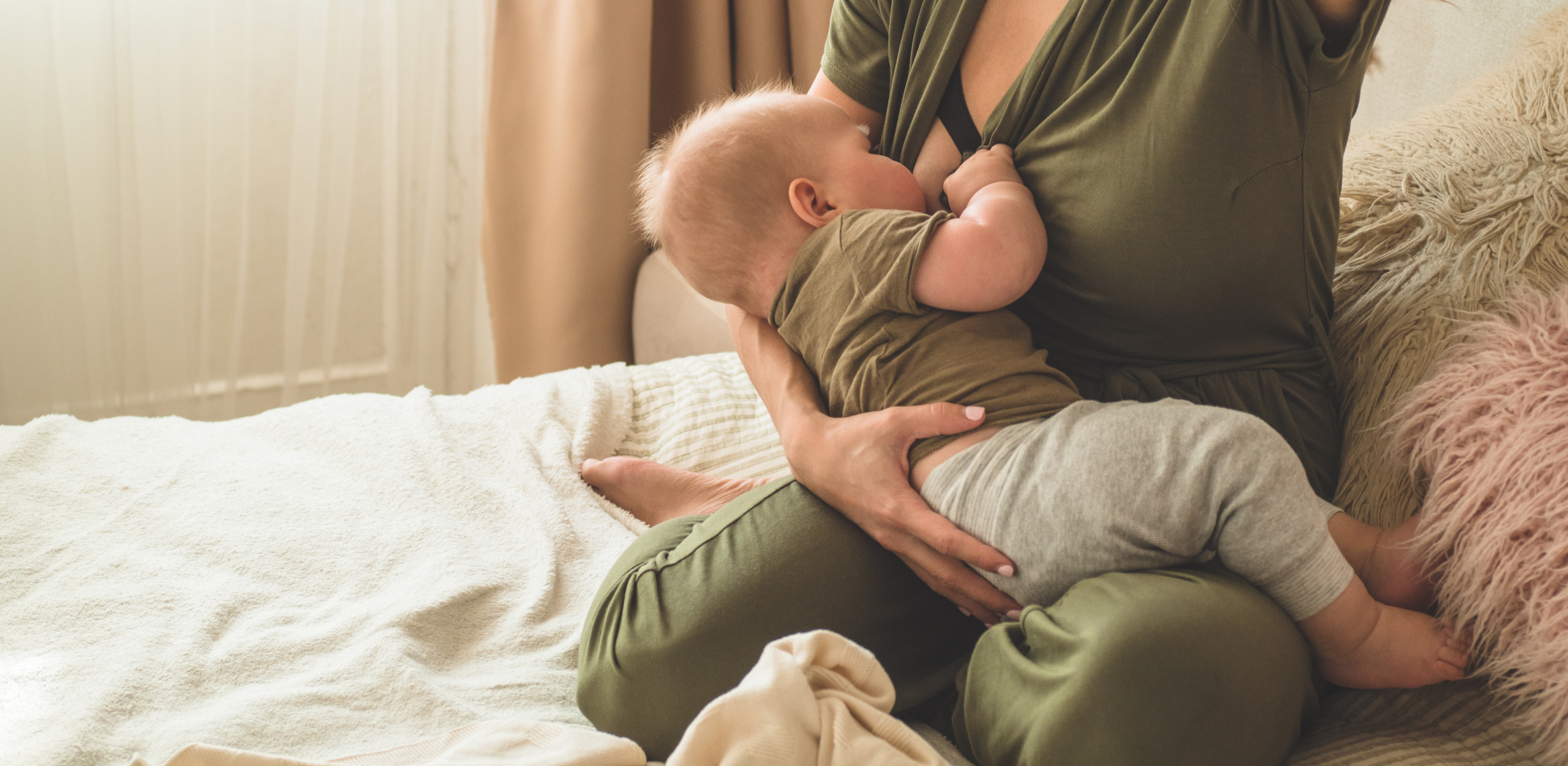 Portrait of mom and breastfeeding baby.